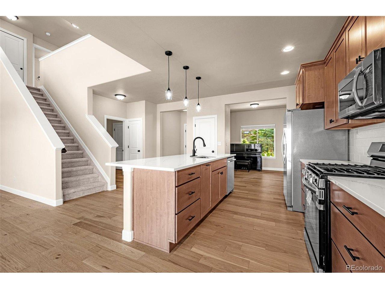 Image 4: Spacious Kitchen with Koch cabinets - Pioneer design with wood dovetails, soft close, pull out drawers, new quartz countertops, new flooring, new lighting, new appliances. Image 4: Spacious Kitchen with Koch cabinets - Pioneer design with wood dovetails, soft close, pull out drawers, new quartz countertops, new flooring, new lighting, new appliances.