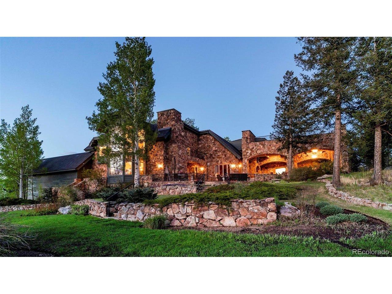 Image 4: Exterior at dusk, offers panoramic views, 2 fireplaces and seating for as many as you can invite