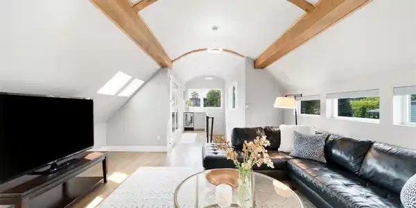 Image 3: The third floor is an entertaining destination with wood-beam ceilings, skylights, a wet bar with beverage refrigerator. Image 3: The third floor is an entertaining destination with wood-beam ceilings, skylights, a wet bar with beverage refrigerator.