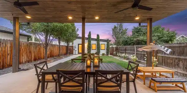 Image 4: Covered patio with ceiling fans, speakers, and a gas line for effortless entertaining. Image 4: Covered patio with ceiling fans, speakers, and a gas line for effortless entertaining.