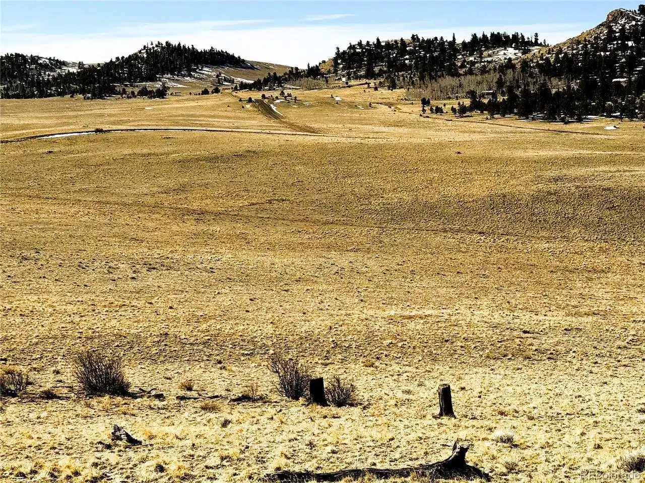 Image 1: View looking over the 10+ acres from Chickamauga Trail to the south side on Comanche Trail