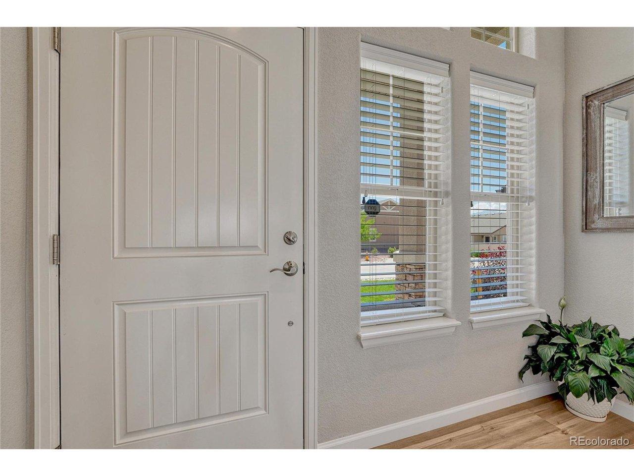 Image 3: Step inside to a bright entryway with warm luxury vinyl flooring and an inviting design that welcomes you home. Image 3: Step inside to a bright entryway with warm luxury vinyl flooring and an inviting design that welcomes you home.