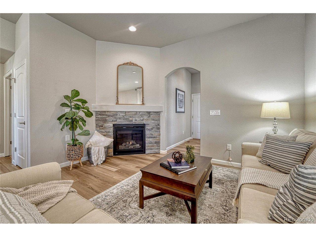 Image 4: Relax and unwind in the living room, where a corner stone gas-log fireplace creates a focal point within the open comfortable layout. Image 4: Relax and unwind in the living room, where a corner stone gas-log fireplace creates a focal point within the open comfortable layout.