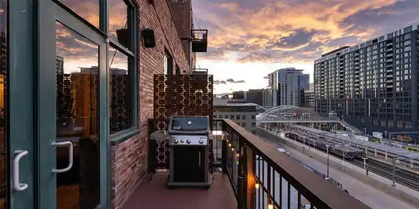 Image 2: A private sixth-floor perch for morning coffee, an evening glass of wine or watching the sun set over the mountains. Outdoor living with elevation, views and privacy-an uncommon luxury in a historic LoDo loft. Image 2: A private sixth-floor perch for morning coffee, an evening glass of wine or watching the sun set over the mountains. Outdoor living with elevation, views and privacy-an uncommon luxury in a historic LoDo loft.