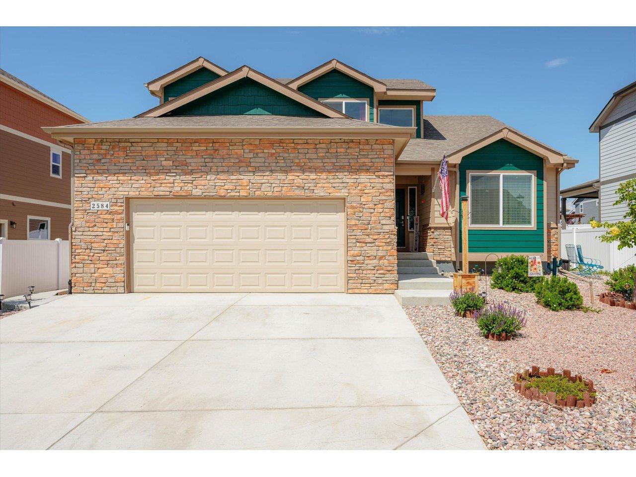 Image 3: Fully Fenced Yard, Large 2 Car Garage with Storage! Stone Front & Colored Accents Add Charm! Image 3: Fully Fenced Yard, Large 2 Car Garage with Storage! Stone Front & Colored Accents Add Charm!