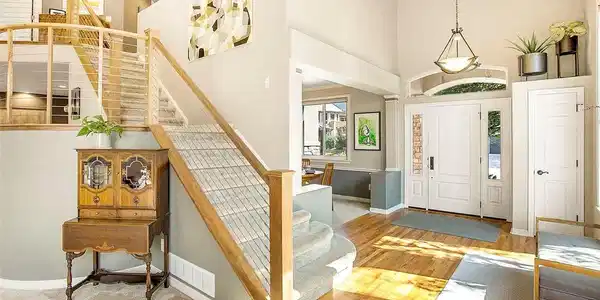 Image 4: Walnut wood and metal railing are the focus for this split staircase. Image 4: Walnut wood and metal railing are the focus for this split staircase.