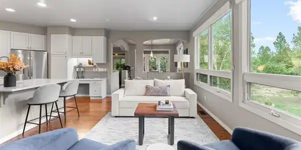 Image 4: A light filled living area framed by outdoor beauty Image 4: A light filled living area framed by outdoor beauty