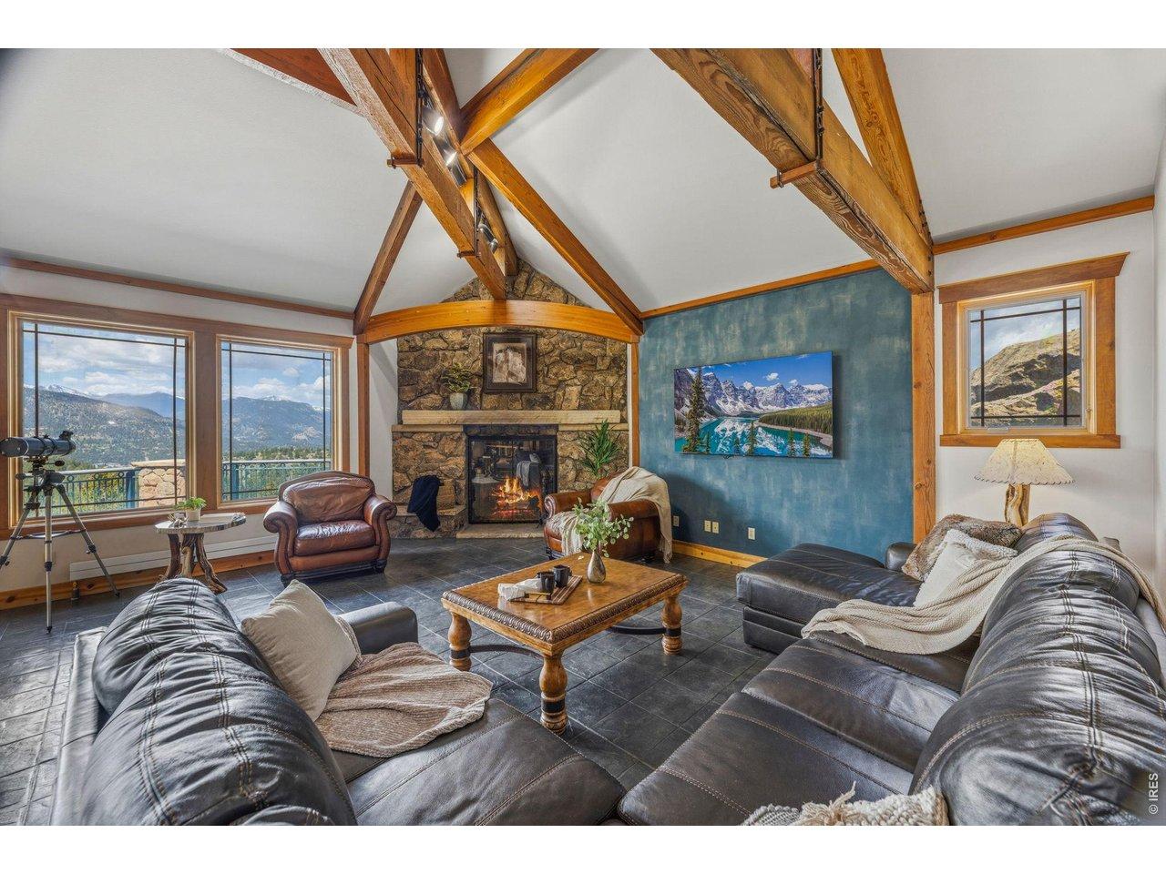 Image 4: The stone fireplace warms the living room Image 4: The stone fireplace warms the living room