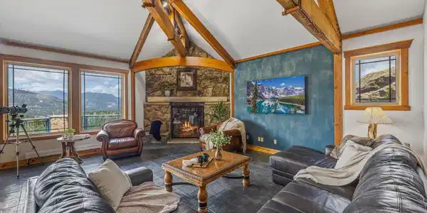 Image 4: The stone fireplace warms the living room Image 4: The stone fireplace warms the living room