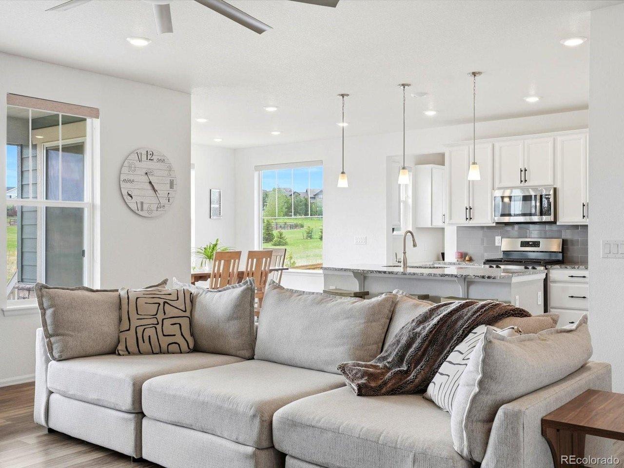 Image 2: Soaring ceilings and an open-concept design create a seamless flow between the spacious living room and gourmet kitchen Image 2: Soaring ceilings and an open-concept design create a seamless flow between the spacious living room and gourmet kitchen