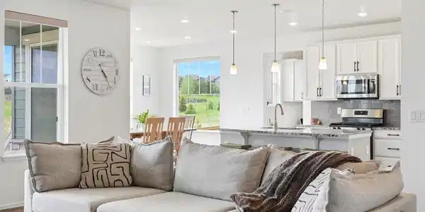 Image 2: Soaring ceilings and an open-concept design create a seamless flow between the spacious living room and gourmet kitchen Image 2: Soaring ceilings and an open-concept design create a seamless flow between the spacious living room and gourmet kitchen