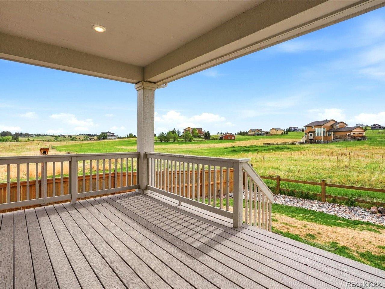 Image 4: Expansive covered back deck with sweeping views of sweeping Colorado views skies Image 4: Expansive covered back deck with sweeping views of sweeping Colorado views skies
