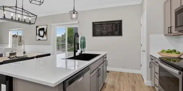 Image 2: The kitchen is ideal for both daily living and entertaining. Huge island with seating, Quartz countertops