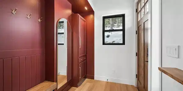 Image 3: Entrance foyer w/bench; mirror and closet/drawer storage Image 3: Entrance foyer w/bench; mirror and closet/drawer storage