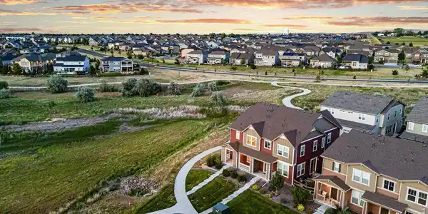 Image 4: Charming corner-lot home with an inviting front porch and scenic open-space views. Image 4: Charming corner-lot home with an inviting front porch and scenic open-space views.