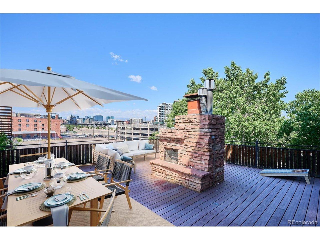 Image 1: Virtually staged upper deck with real fireplace Image 1: Virtually staged upper deck with real fireplace
