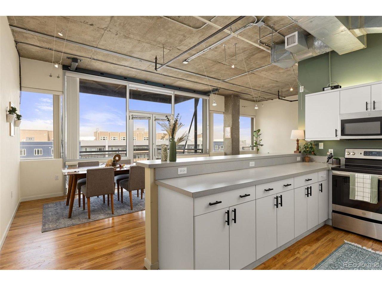 Image 4: Open concept with kitchen, 4 or more person bar space and dining area. Image 4: Open concept with kitchen, 4 or more person bar space and dining area.