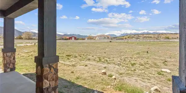 Image 4: covered front porch with expansive views mountain views to the west