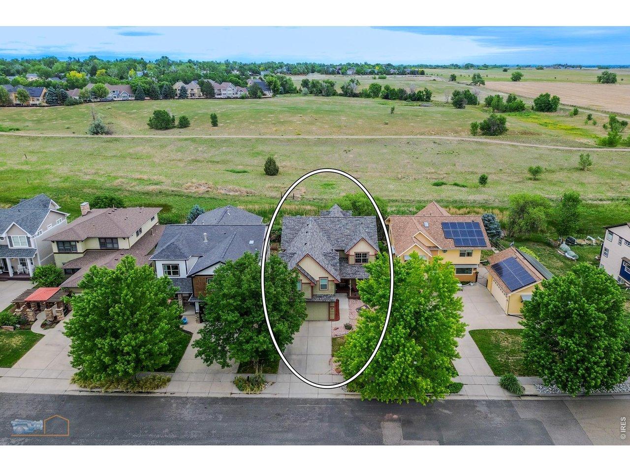 Image 1: Aerial view of home backing to open space