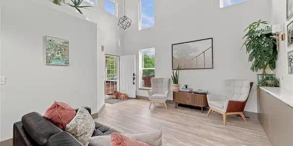 Image 4: Soaring ceilings, abundant windows and built-in cabinetry give the main living room both drama and everyday functionality. Image 4: Soaring ceilings, abundant windows and built-in cabinetry give the main living room both drama and everyday functionality.