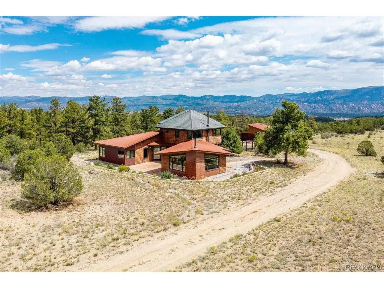 Image 1: 17121 Kiowa Rd, Nathrop CO 81236 - Mesa Antero Estates - 35.34 Acres. Hardie board siding, standing seam metal roofing, corrugated metal siding, and stone accents create a distinctive mountain contemporary exterior, while energy efficient Structural Insula Image 1: 17121 Kiowa Rd, Nathrop CO 81236 - Mesa Antero Estates - 35.34 Acres. Hardie board siding, standing seam metal roofing, corrugated metal siding, and stone accents create a distinctive mountain contemporary exterior, while energy efficient Structural Insula