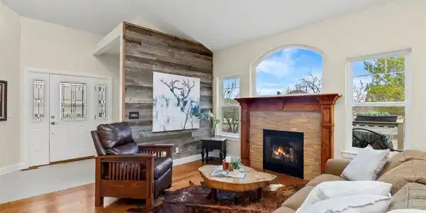Image 2: Living Room with views of the foothills. Cozy fireplace, vaulted ceilings and mixed use entertainment space Image 2: Living Room with views of the foothills. Cozy fireplace, vaulted ceilings and mixed use entertainment space