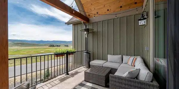 Image 4: Covered deck with wood beam ceiling overlooking scenic mountain, golfcourse, and valley views Image 4: Covered deck with wood beam ceiling overlooking scenic mountain, golfcourse, and valley views