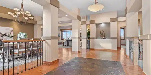 Image 3: A grand entrance sets the tone - soaring ceilings and warm finishes from the moment you walk in Image 3: A grand entrance sets the tone - soaring ceilings and warm finishes from the moment you walk in