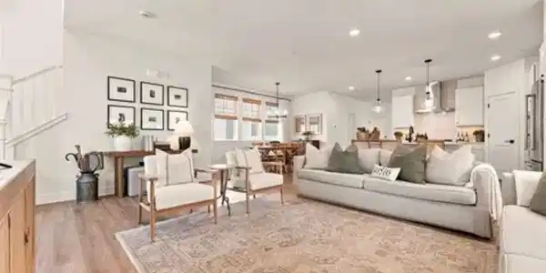 Image 2: Here's the bigger picture: kitchen, dining, and living spaces flow together naturally, with abundant light and custom details adding warmth throughout. Image 2: Here's the bigger picture: kitchen, dining, and living spaces flow together naturally, with abundant light and custom details adding warmth throughout.
