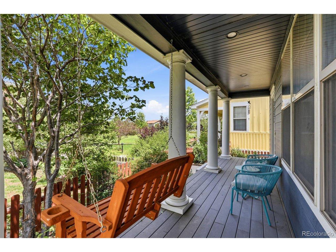 Image 3: Front Porch with mature plantings and trees in private corner of courtyard Image 3: Front Porch with mature plantings and trees in private corner of courtyard