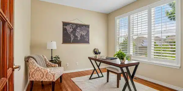 Image 4: Main Floor study with lighted French doors and Plantation shutters Image 4: Main Floor study with lighted French doors and Plantation shutters