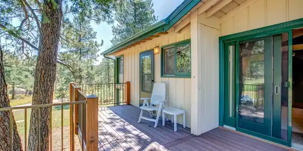 Image 4: Come relax on the deck and take in the beautiful outdoor space, perfect for entertaining or enjoying your morning coffee in a peaceful setting.