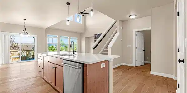 Image 3: View of the Kitchen open to the Great Room and walk-out dining area. Image 3: View of the Kitchen open to the Great Room and walk-out dining area.