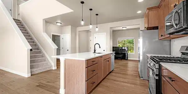 Image 4: Spacious Kitchen with Koch cabinets - Pioneer design with wood dovetails, soft close, pull out drawers, new quartz countertops, new flooring, new lighting, new appliances. Image 4: Spacious Kitchen with Koch cabinets - Pioneer design with wood dovetails, soft close, pull out drawers, new quartz countertops, new flooring, new lighting, new appliances.
