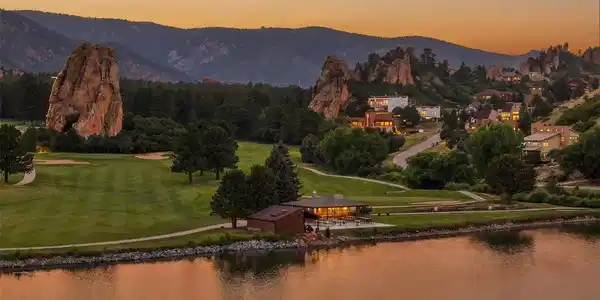 Image 2: A rare Perry Park setting where Lake Wauconda, the golf course, red rock formations, and sunset skies come together in one unforgettable view.