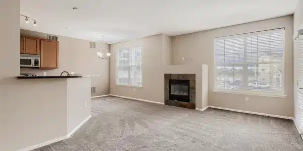 Image 4: Bright, open-concept living area featuring a cozy gas fireplace and abundant natural light. Image 4: Bright, open-concept living area featuring a cozy gas fireplace and abundant natural light.