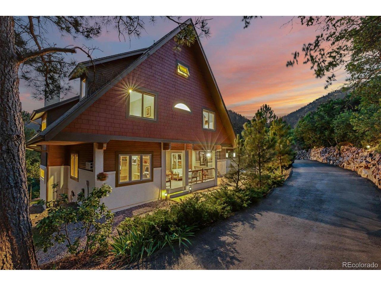 Image 1: Twilight welcomes you home as this custom mountain retreat blends beautifully into its wooded surroundings. Image 1: Twilight welcomes you home as this custom mountain retreat blends beautifully into its wooded surroundings.