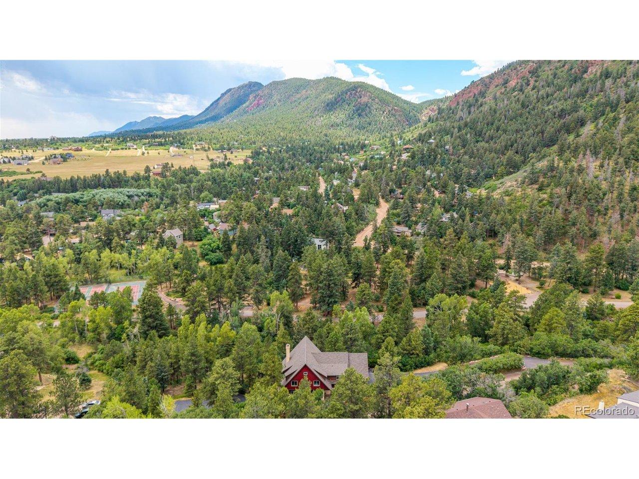 Image 2: Chautauqua Mountain rises above the property, showcasing the spectacular setting that surrounds the home. Image 2: Chautauqua Mountain rises above the property, showcasing the spectacular setting that surrounds the home.