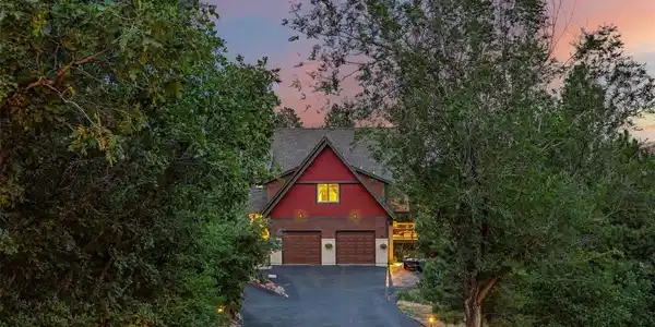 Image 3: A tree-lined driveway creates a memorable arrival with the home tucked privately among the pines. Image 3: A tree-lined driveway creates a memorable arrival with the home tucked privately among the pines.