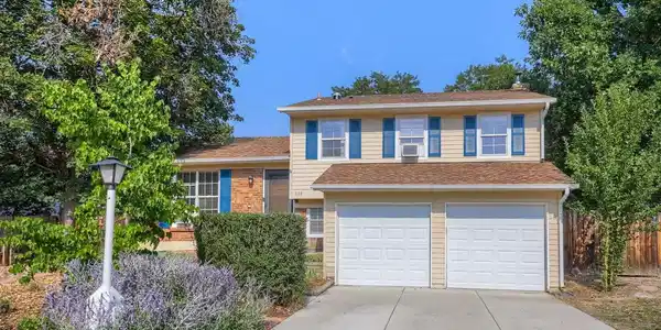 Image 2: Front of house and garages