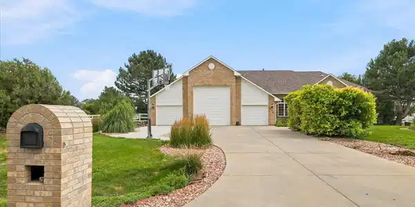 Image 4: Expansive driveway parking. 3 car garage with RV door. Image 4: Expansive driveway parking. 3 car garage with RV door.