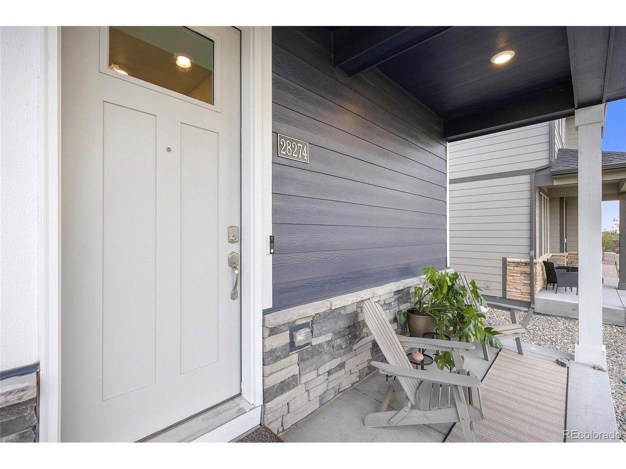 Image 4: Charming covered front porch to sit out and enjoy a cup of coffee.