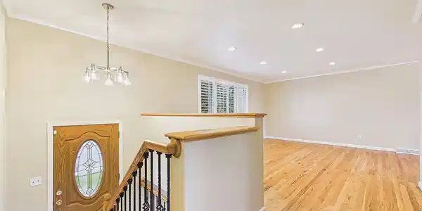Image 3: Entry & Living Room - Bright, inviting entry opens to the main living area, showcasing freshly refinished hardwood floors, fresh interior paint, and an open, airy layout. Image 3: Entry & Living Room - Bright, inviting entry opens to the main living area, showcasing freshly refinished hardwood floors, fresh interior paint, and an open, airy layout.