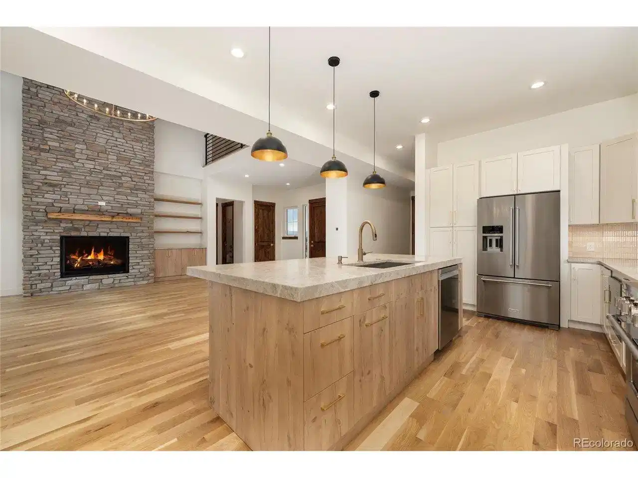 Image 1: Kitchen looking into family room.