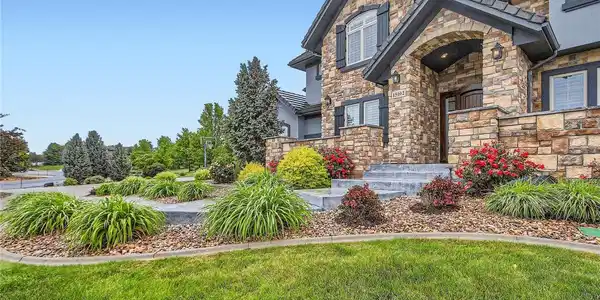 Image 4: Escape to your own private oasis on 1.39 acres of meticulously manicured grounds. The expansive yard offers endless possibilities.