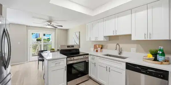 Image 2: Fully Renovated Kitchen with Quartz Countertops and New Stainless Steel Appliances