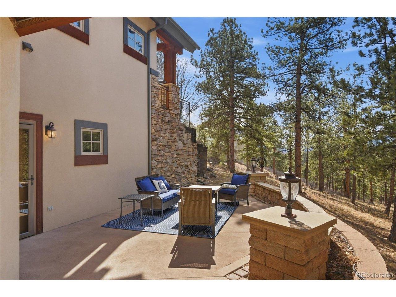 Image 4: Driveway path leads to lower level patio, drip system in garden beds