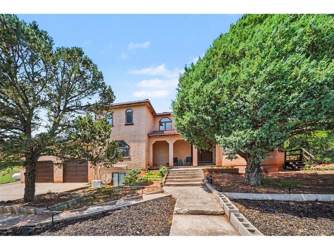 Image 2: Steps lead to the front door, surrounded by the beauty of the Red Rock Valley setting Image 2: Steps lead to the front door, surrounded by the beauty of the Red Rock Valley setting