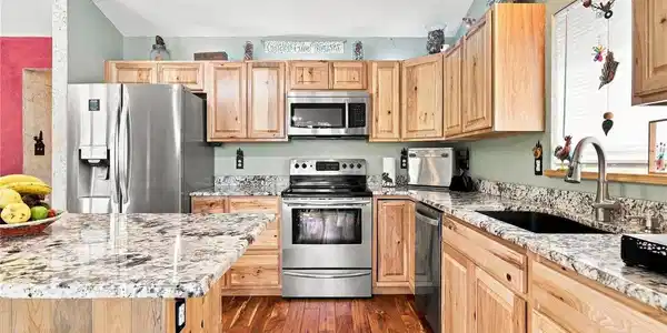 Image 2: Cook and entertain effortlessly in the open kitchen, fully equipped with premium granite countertops, stainless steel appliances, and a center island. Image 2: Cook and entertain effortlessly in the open kitchen, fully equipped with premium granite countertops, stainless steel appliances, and a center island.