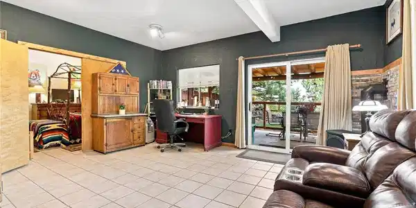 Image 3: Exceptional multigenerational potential: The independent lower level features its own full living quarters, private en-suite bathroom, and separate walkout entrance. Image 3: Exceptional multigenerational potential: The independent lower level features its own full living quarters, private en-suite bathroom, and separate walkout entrance.